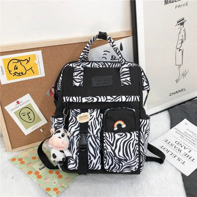 New Trendy Casual Women Purple Backpacks Fashionable Black Cow Pattern Travel Bag And School Bag for Teenager And Girls