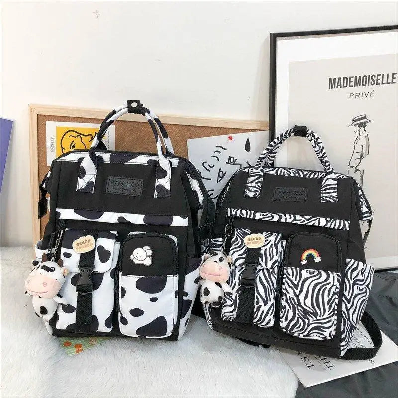 New Trendy Casual Women Purple Backpacks Fashionable Black Cow Pattern Travel Bag And School Bag for Teenager And Girls