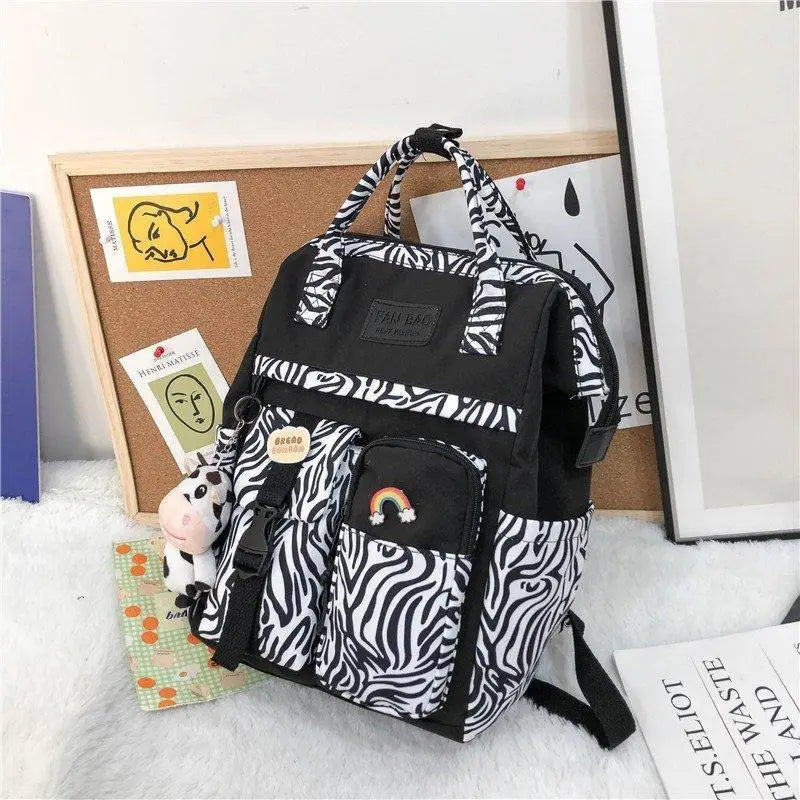 New Trendy Casual Women Purple Backpacks Fashionable Black Cow Pattern Travel Bag And School Bag for Teenager And Girls