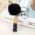 Luxury Black Pompom English Alphabet Letter Keychain Rhinestone Keyring with Artificial Fur Pompom Ball Women Girls Shiny Crystal Key Ring Letter Keyring Glitter Gradient Resin Car Mirror Accessory Women Handbag Charms